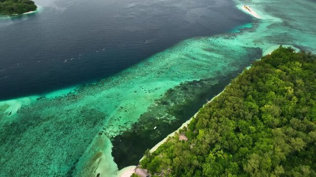 Aerial view of a tropical island with pristine beaches and turquoise ocean, Solomon Islands.