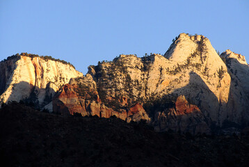 The towers of the Virgin, along the rim of Zion Canyon in Utah, in the golden light of Dawn.