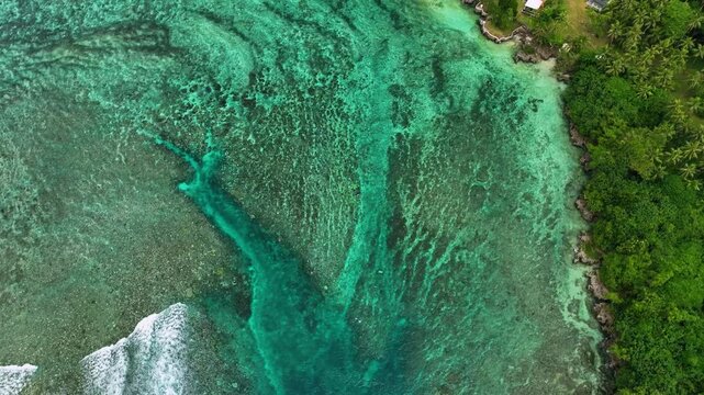 Aerial view of a tropical island with turquoise water, coral reef, and palms, Shefa Province, Vanuatu.