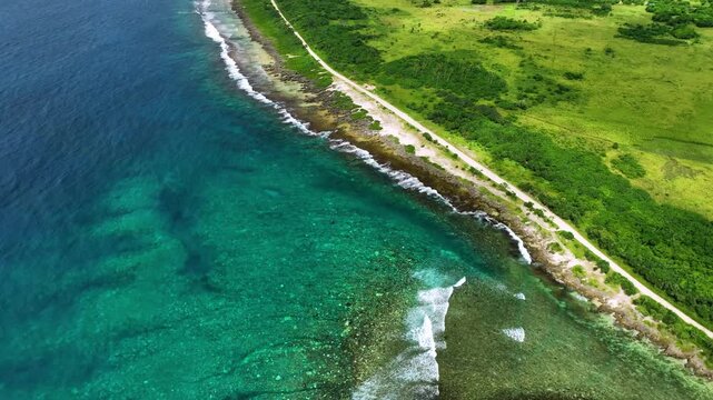 Aerial view of a beautiful tropical island with pristine beaches, turquoise waters, and lush palms, Shefa Province, Vanuatu.