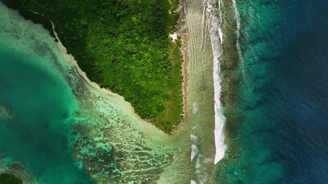 Aerial view of a beautiful tropical island with lush greenery and crystal clear turquoise waters, Shefa Province, Vanuatu.