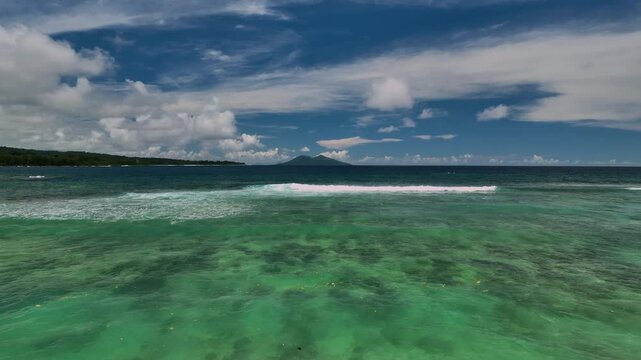 Aerial view of a beautiful tropical island with turquoise waters and pristine reef, Shefa Province, Vanuatu.