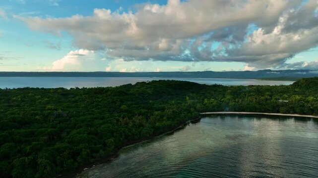 Aerial view of a tranquil tropical island with lush greenery and serene ocean, Shefa Province, Vanuatu.