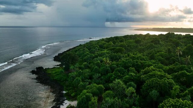 Aerial view of a beautiful tropical island with lush palms and serene waves, Shefa Province, Vanuatu.