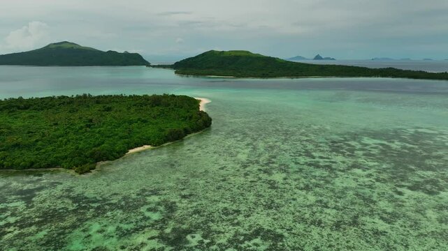 Aerial view of tropical islands and pristine reef in clear ocean, Shefa Province, Vanuatu.