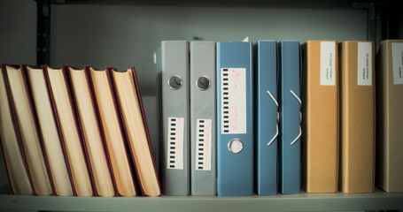 Dolly shot of protective cases, paper boxes and folders with ancient artifacts or fossils for...