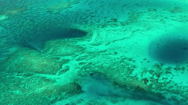 Aerial view of abstract reef and turquoise waves in the ocean, Shefa Province, Vanuatu.