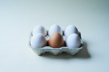 Eggs, box and difference with background for breakfast, cooking or protein nutrition. Organic, collection and chicken produce with food, vitamin or antioxidants for production or easter on mockup