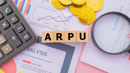 Wooden cube with the word ARPU. It is an abbreviation of Average Revenue Per User. Business profitability success growth profitability analytics. Business and financial market concept.