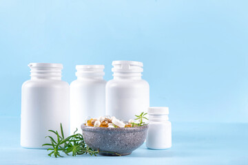 Homeopathic medicine pills, various colorful medicine pills and capsules, dietary supplements with herbs and plants.. Natural and alternative medicine, Eco organic medicine concept