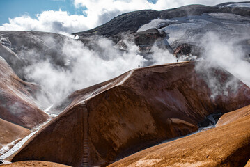 Geothermal Valley with Steam Vents and Colorful Hills