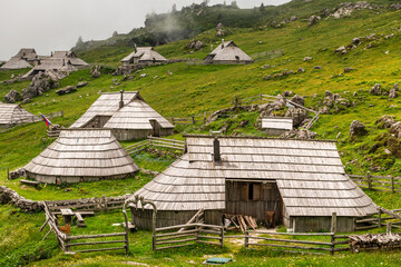 Velika Planina or Great plateau, Slovenia highlands with architecture of wooden huts and barns