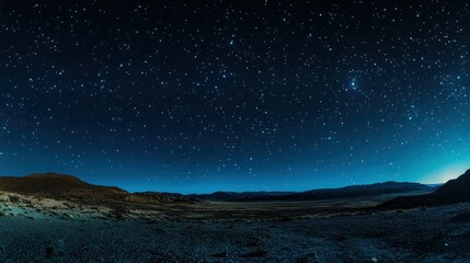 Fototapeta premium A panoramic view of a starry night sky over a serene landscape.