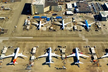 Airplanes on tarmac. Lines, patterns, parked. 