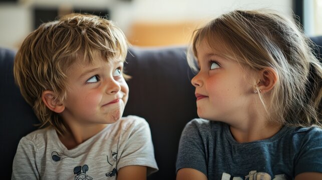 A kid rolling their eyes while their sibling talks loudly.