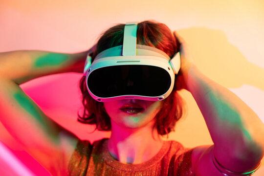 Woman exploring colorful virtual reality in metaverse setting