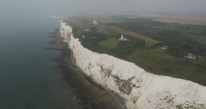 Aerial view of the beautiful white cliffs of Dover along the rugged coastline of the English Channel, Dover, United Kingdom.