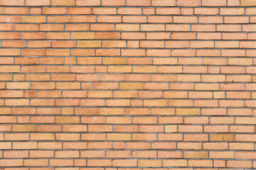Background from a wall made of orange clinker bricks
