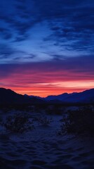 Obraz premium Stunning Desert Sunset Wallpaper for Phones - Indigo and Scarlet Sky
