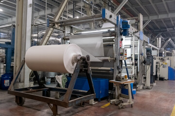 Fabric batching process machine industrial plant line in a textile factory.