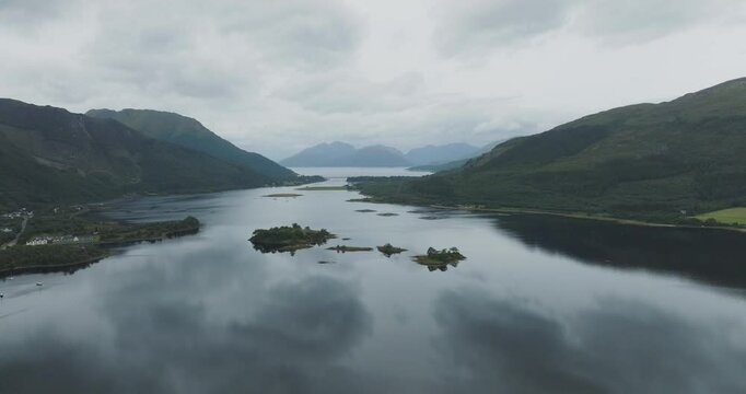 Aerial view of serene Loch Leven surrounded by majestic mountains and tranquil waters, Glencoe, Scotland.