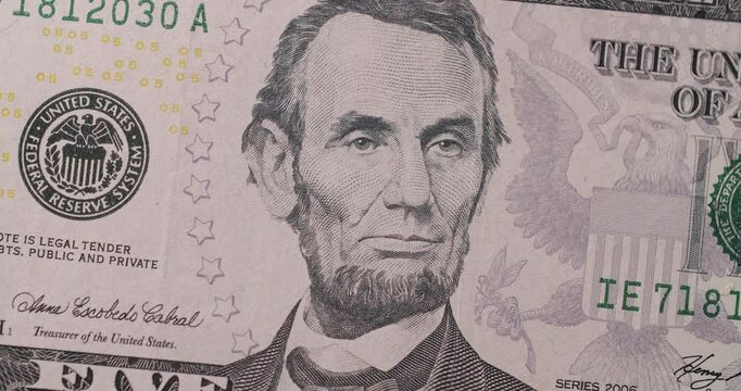 US President Lincoln on United States. American five dollar paper banknote front side zoom in close up macro. 5 Dollar Closeup. Zoom of 5 USD Bills. Rich business economy of usa. Five USD.