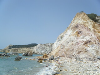 Scenic Greek Beach. Colorful rocks and beautiful blue water. 