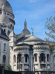 Obraz premium PARIS, FRANCE - April 13, 2024: Paris aerial panorama view from the steps of Sacre Coeur church at the top of Monmatre