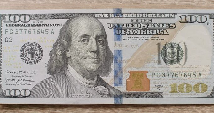 Zoom in American one hundred dollar front sade paper banknote. 100 Dollar Cash. Hundred Dollar Closeup. Rich business economy of usa. Concept Finance Business Investment Success.