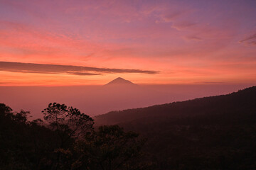 Stunning Sunrise Silhouette of a Distant Volcano