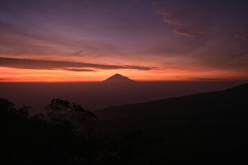 Stunning Sunrise Silhouette of a Distant Volcano