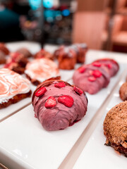Croissants and pastries in the window of a coffee shop. Stand with croissants in a store. Concept of croissants and pastries