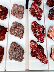 Croissants and pastries in the window of a coffee shop. Stand with croissants in a store. Concept of croissants and pastries