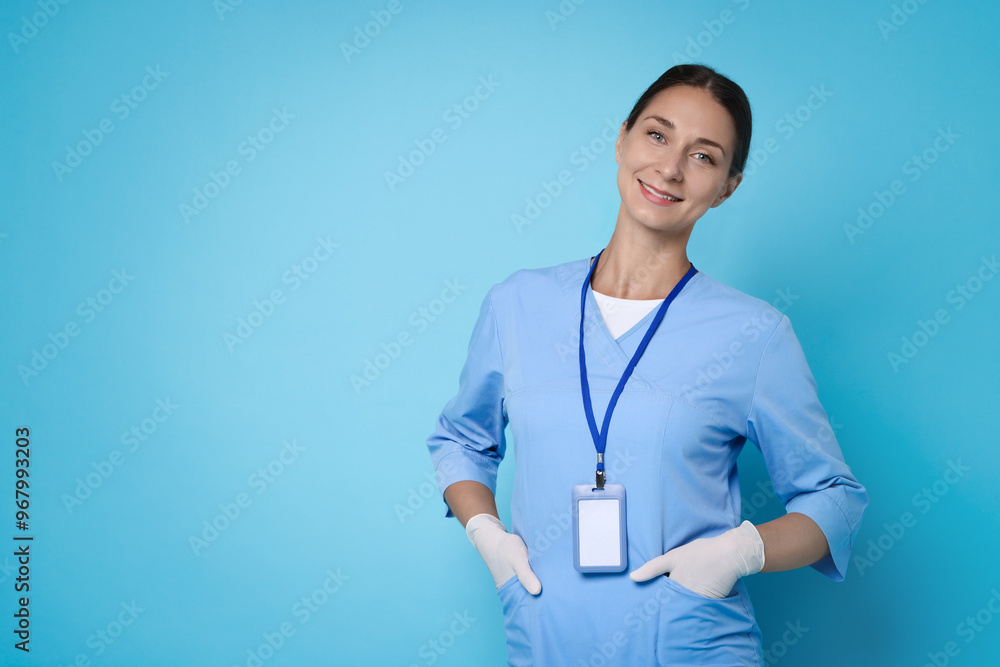 Poster Nurse in medical uniform on light blue background, space for text