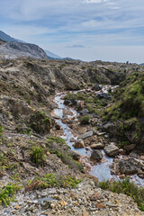 Mountain Stream Amidst Volcanic Cliffs