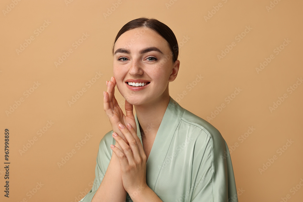 Sticker Beautiful young woman with healthy skin on beige background