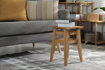 Wooden stool with books in living room