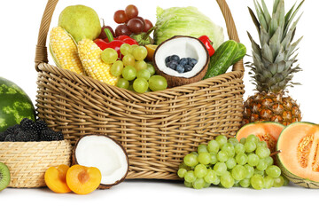 Wicker basket with different fresh vegetables and fruits isolated on white
