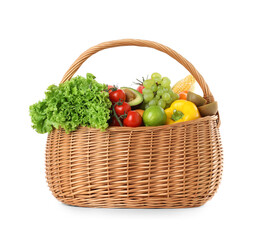 Different fresh vegetables and fruits in wicker basket isolated on white