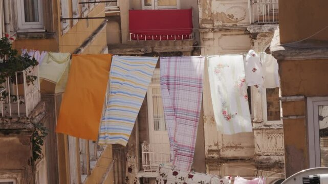 Clothes are drying in stanbul, turkey street, Colorful Laundry Pieces Gracefully Hanging Amidst Contemporary Urban Architecture Scenes