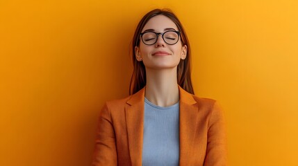 Smiling blonde businesswoman in glasses looks confidently into the camera