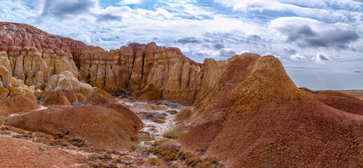 Panoramic Akzhar Ulytau chalk mountains of Kazakhstan. Rare sandy hills with many multi-colored...