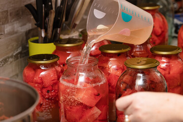 Preparation of homemade canned pickles - salted watermelons in jars