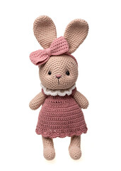 Handmade crocheted bunny toy, amigurumi, isolated.