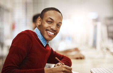 Obraz premium Portrait, smile and student learning at library for education, knowledge or test preparation in college. University scholarship, man and confidence for studying, project notes and online exam report