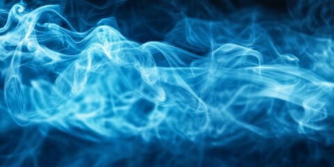 Obraz premium Swirling blue smoke dances in the dark, forming an enchanting abstract display that captivates the imagination