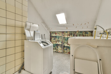Vintage laundry room interior with floral curtain