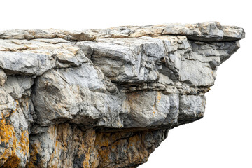 Close-up of a rugged cliff edge showcasing textured rock formations and natural geological patterns.