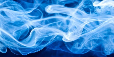 Fototapeta premium A delicate blue smoke curls and undulates, creating an enchanting visual effect on a dark background, evoking a sense of tranquility