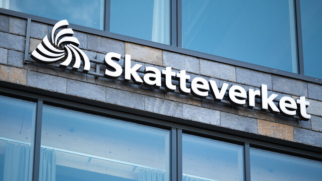 Skatteverkets logotype on a building facade. Skatteverket is the Swedish tax agency.  It is a government agency responsible for collecting taxes, civil registration and to surveil the tax system.